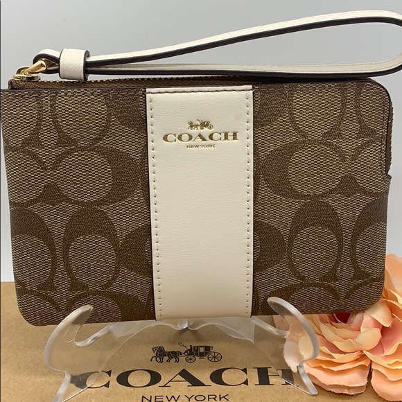 Coach Handbags - COACH Corner Zip Wristlet In Signature Canvas